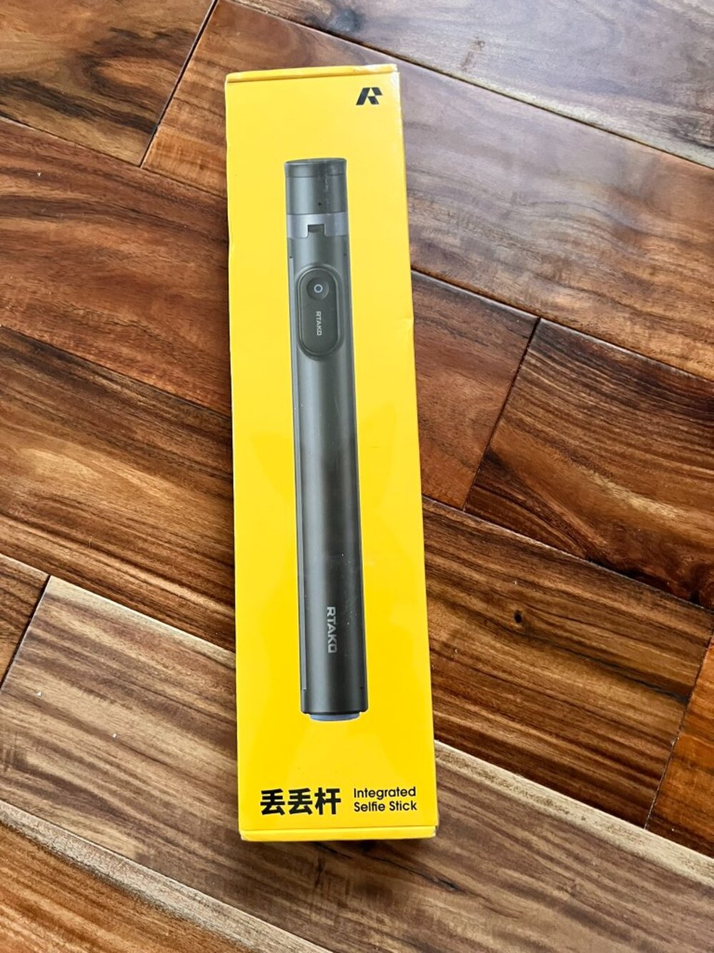 New factory-sealed RTAKO Oth-AB226 integrated selfie stick and tripod in black.